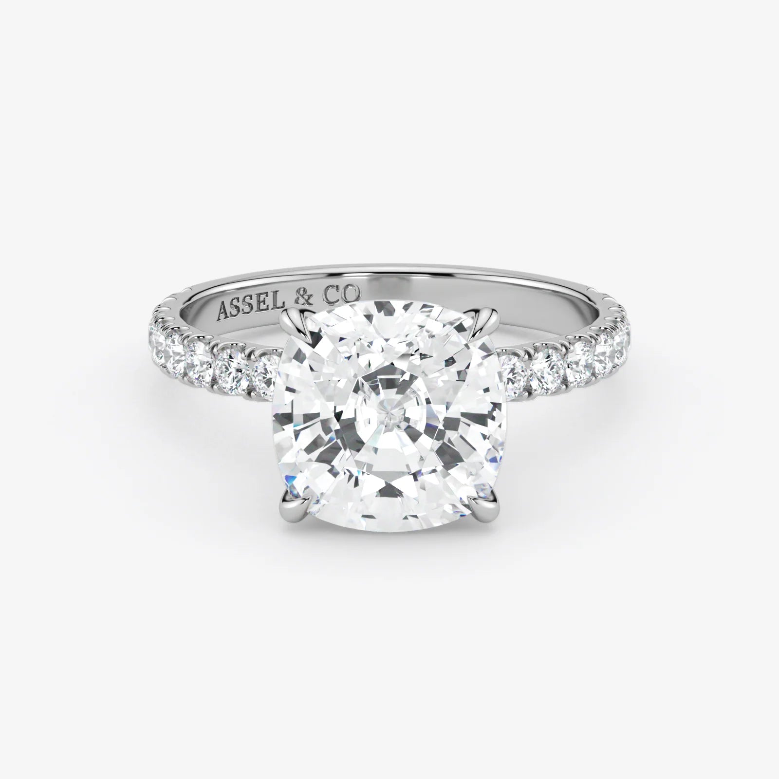 Diamond ring with 'Assel & Co' branding on a white background