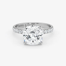 Diamond ring with 'Assel & Co' branding on a white background