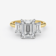 Gold and diamond ring with 'Graff' branding on a white background