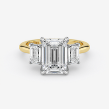Gold and diamond ring with 'Graff' branding on a white background