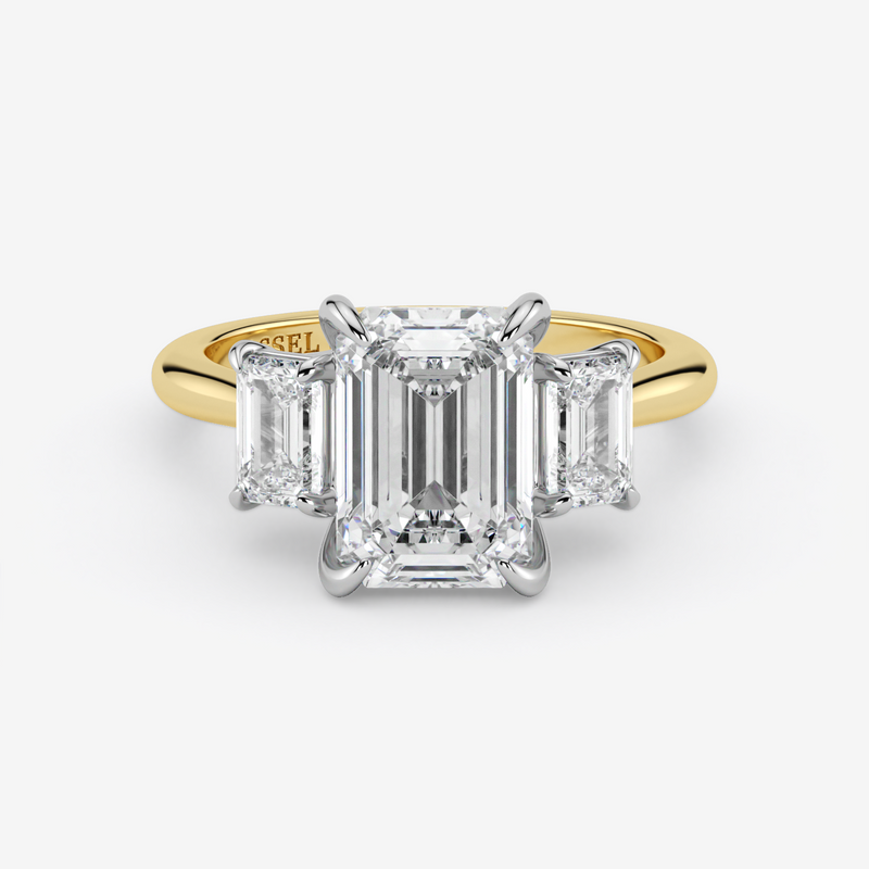 Gold and diamond ring with 'Graff' branding on a white background