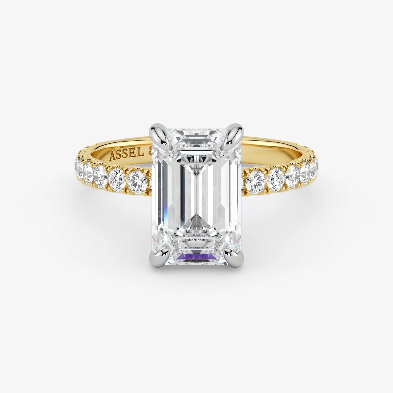 Gold ring with a large diamond and smaller diamonds on the band against a white background