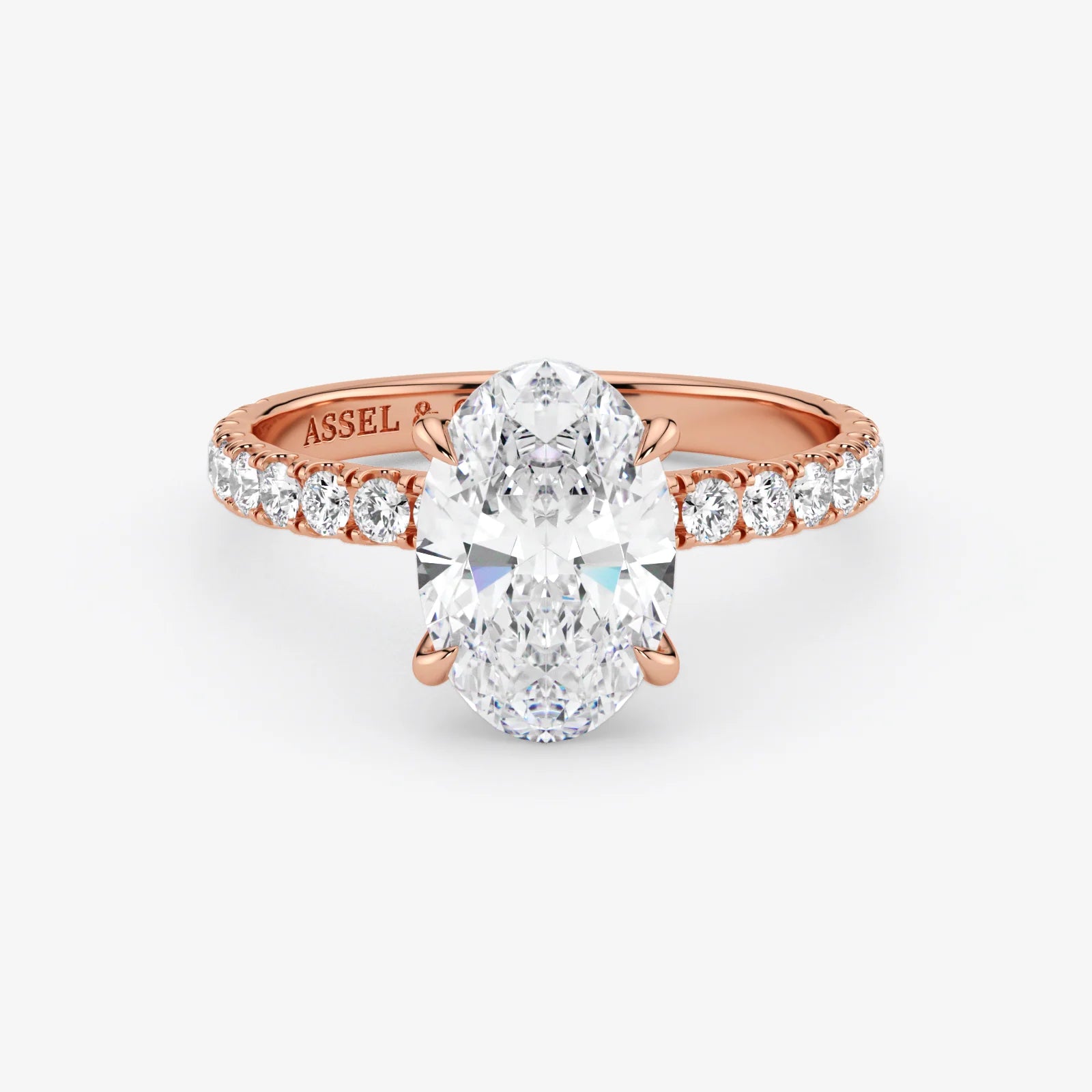 Rose gold ring with a large diamond and smaller diamonds on the band against a white background