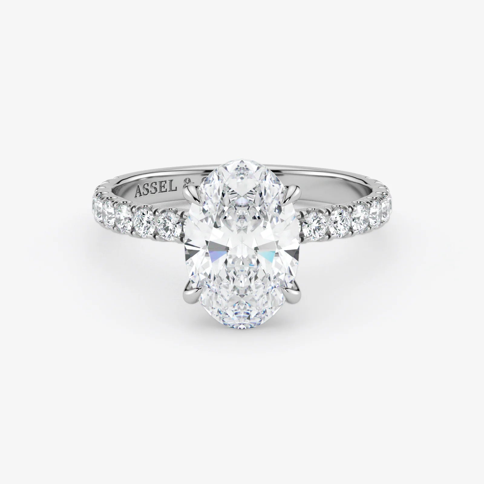 Diamond ring with 'Assael' branding on a white background