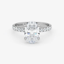Diamond ring with 'Assael' branding on a white background