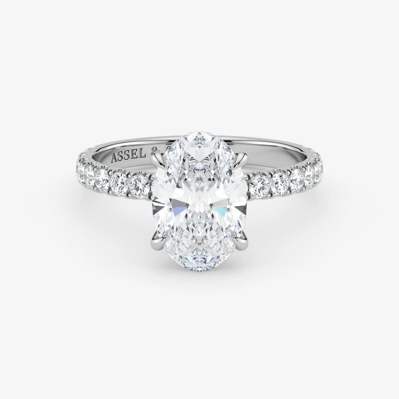 Diamond ring with 'Assael' branding on a white background