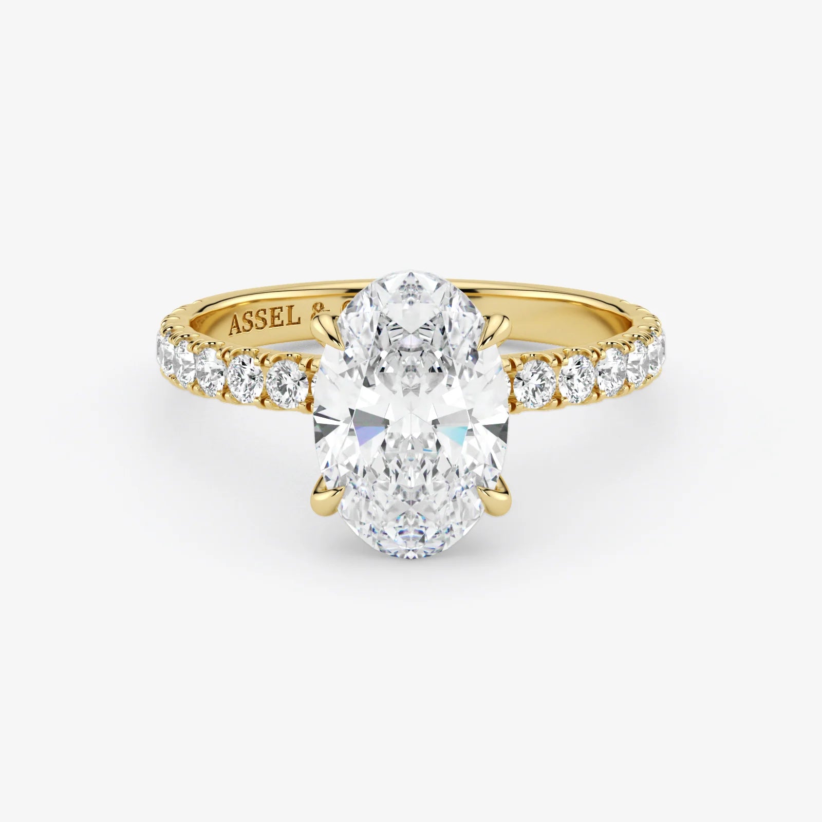Gold ring with a large diamond and smaller diamonds on the band against a white background