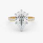 Gold and silver diamond ring on a white background