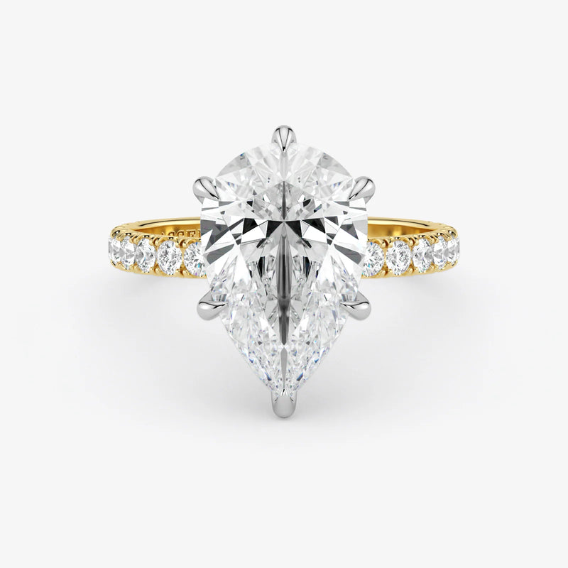 Gold and silver diamond ring on a white background