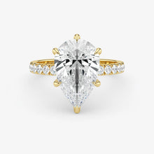 Gold and silver diamond ring on a white background