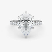 Diamond ring with a pear-shaped center stone on a white background