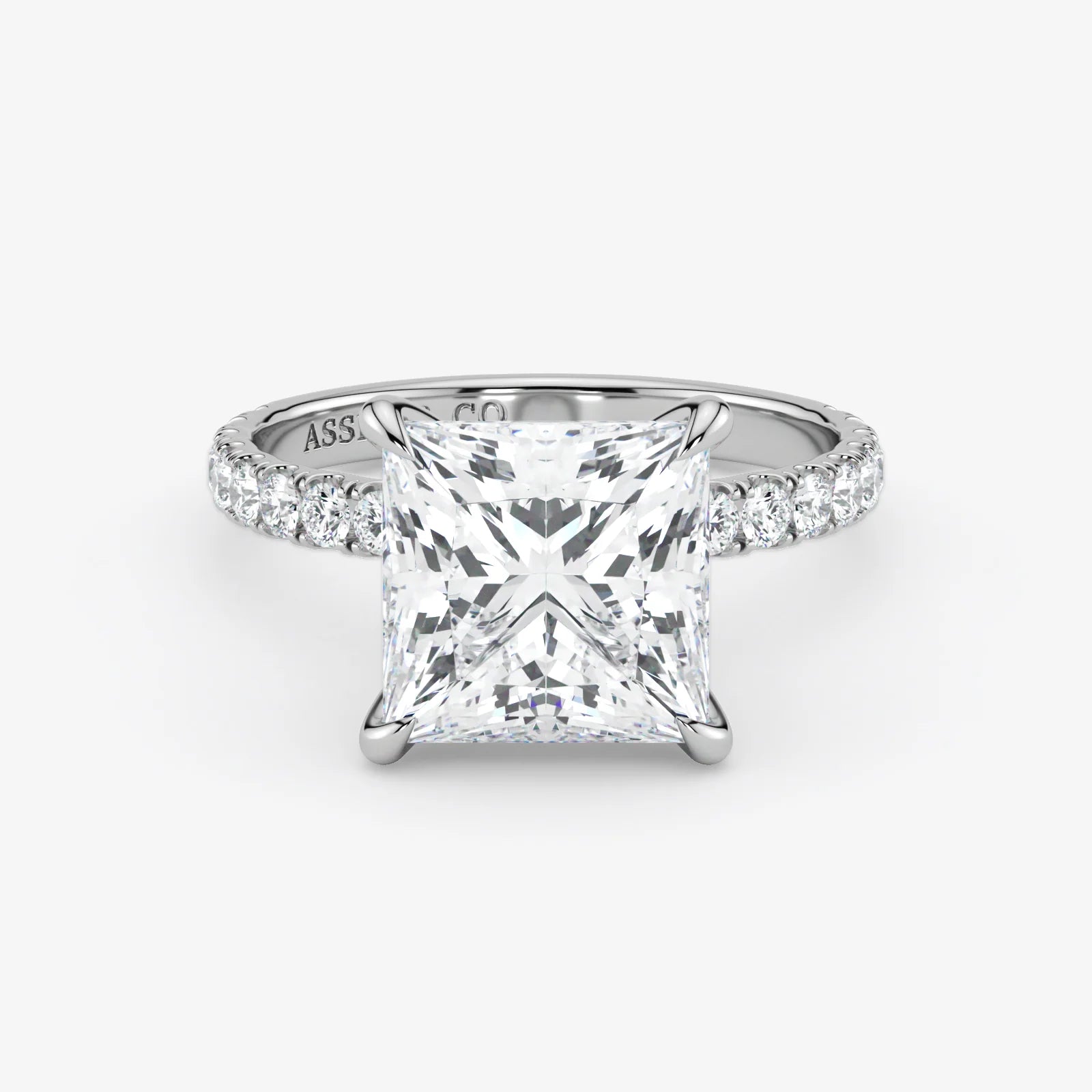 Diamond ring with a princess-cut diamond on a white background