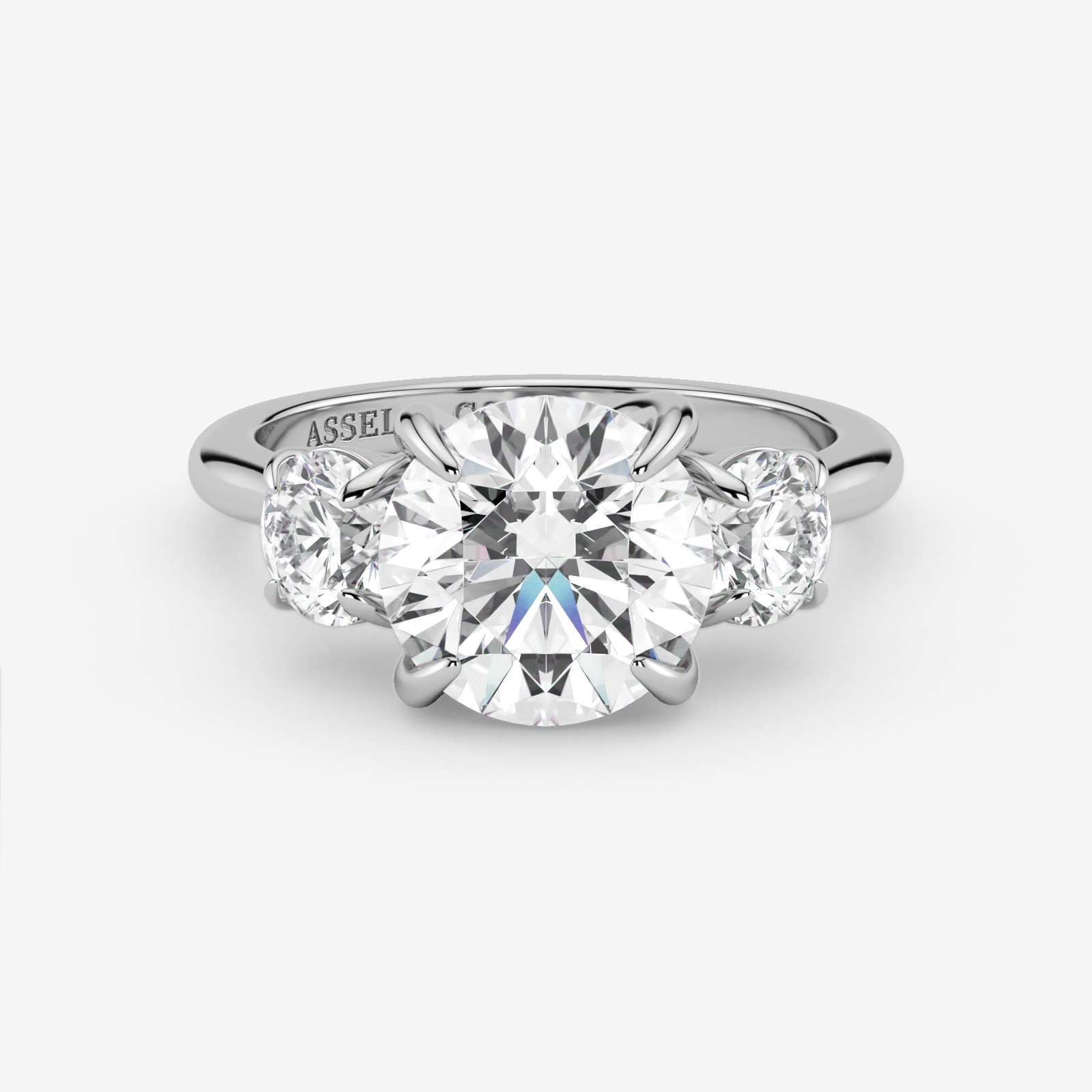 Diamond ring with 'Assael' branding on a white background