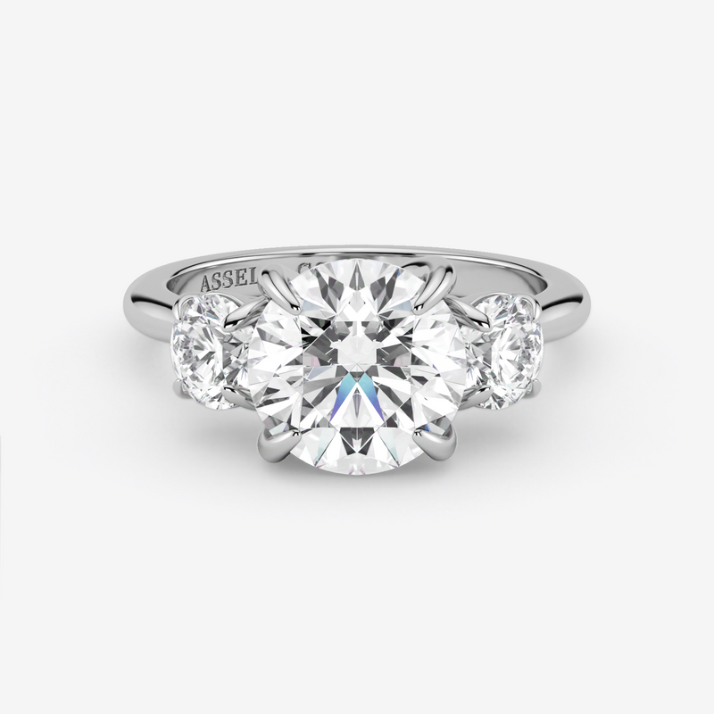 Diamond ring with 'Assael' branding on a white background