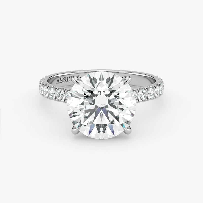 Diamond ring with 'Assante' branding on a white background