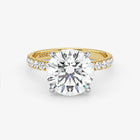 Gold ring with a large diamond on a white background