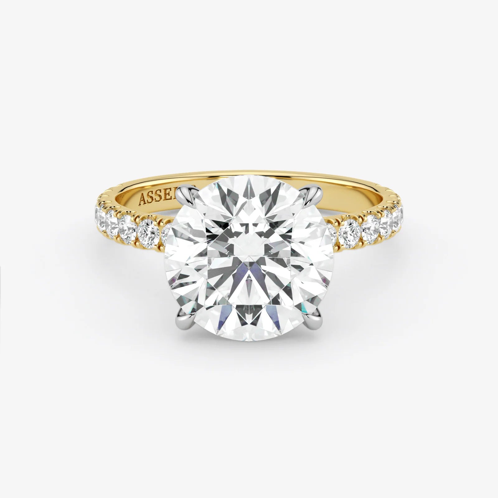 Gold ring with a large diamond on a white background