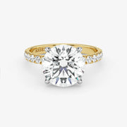 Gold ring with a large diamond on a white background