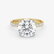 Gold ring with a large diamond on a white background