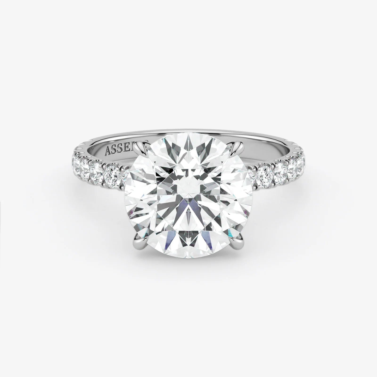 Diamond ring with 'Assante' branding on a white background