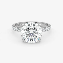 Diamond ring with 'Assante' branding on a white background