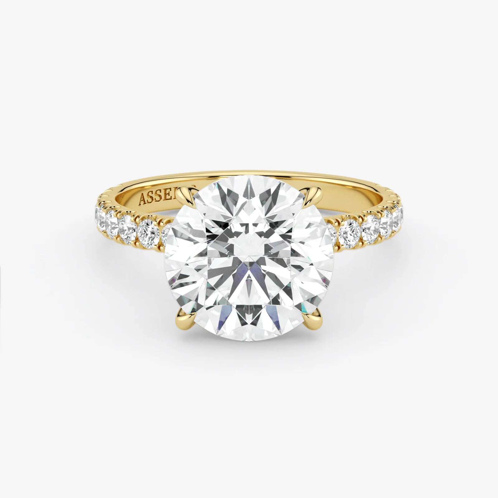 Gold ring with a large diamond on a white background