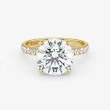 Gold ring with a large diamond on a white background