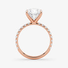 Rose gold ring with a diamond on a white background