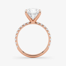 Rose gold ring with a diamond on a white background