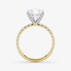 Gold ring with a diamond on a white background