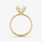 Gold ring with a diamond on a white background