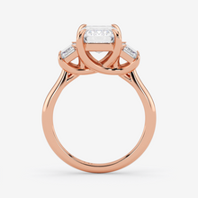 Rose gold ring with a diamond on a white background