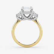 Two-tone gold ring with diamond accents on a white background