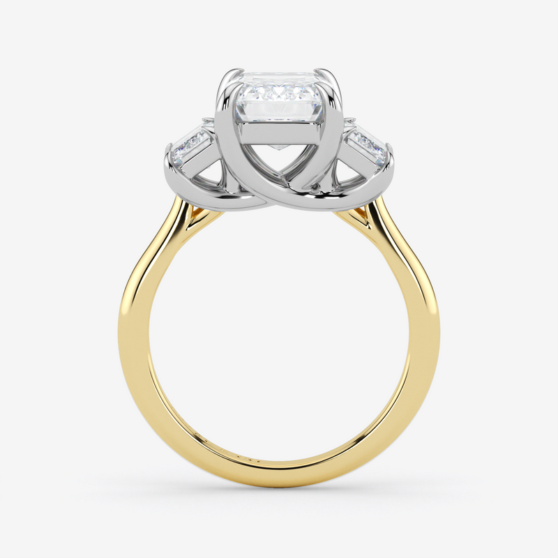 Two-tone gold ring with diamond accents on a white background