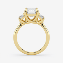 Gold ring with a diamond on a white background