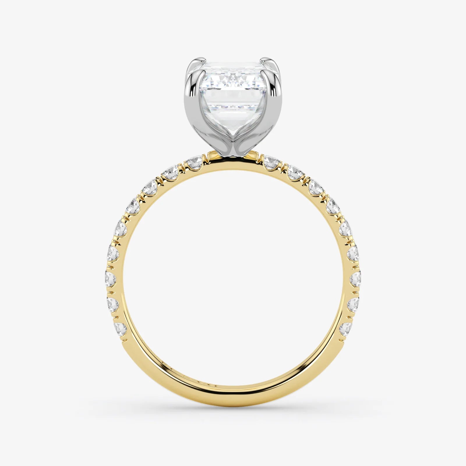 Two-tone diamond ring with a heart-shaped center stone on a white background