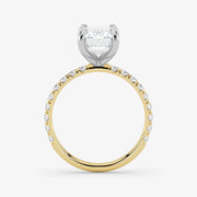 Two-tone diamond ring with a heart-shaped center stone on a white background