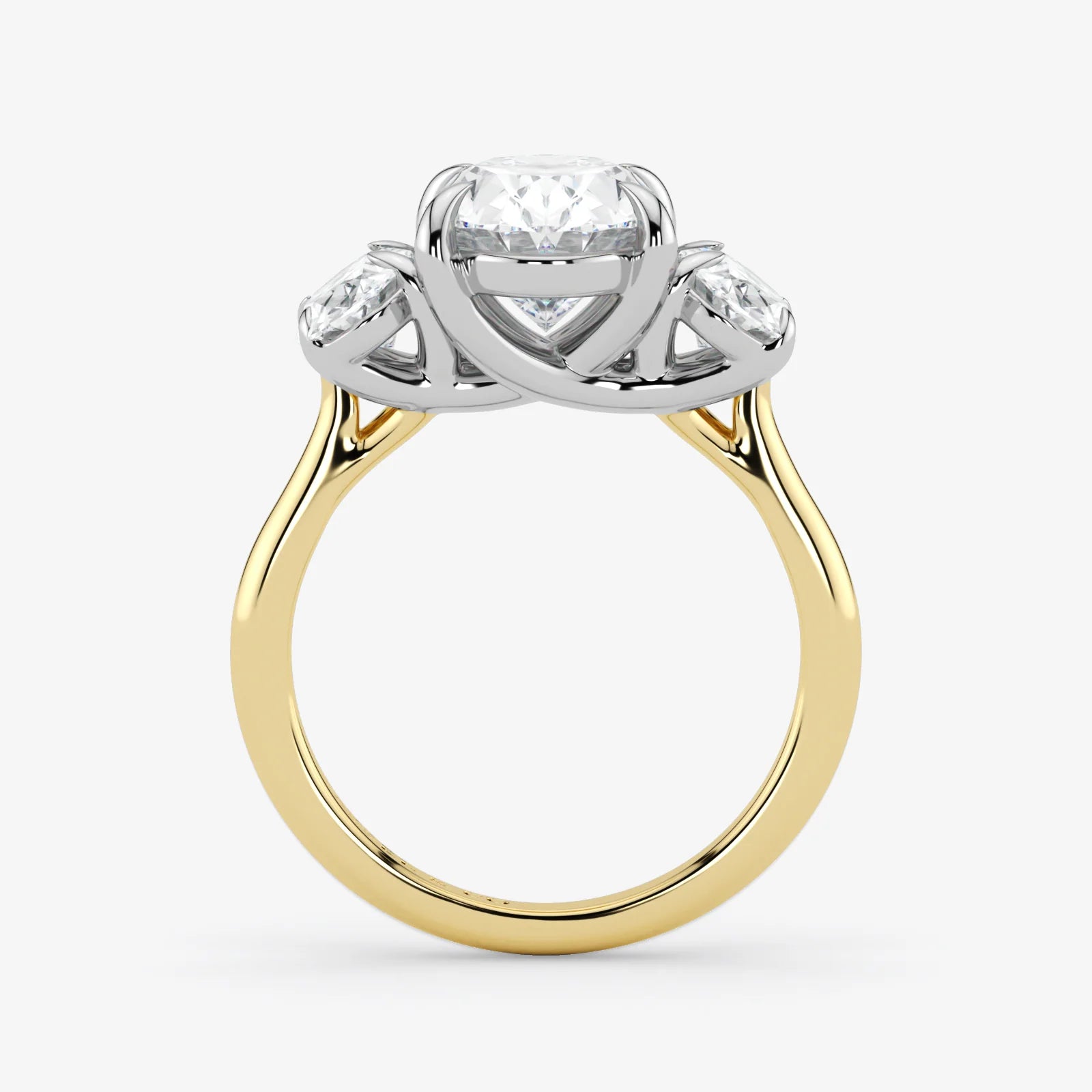 Gold and silver ring with a diamond on a white background