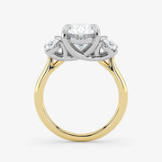 Gold and silver ring with a diamond on a white background