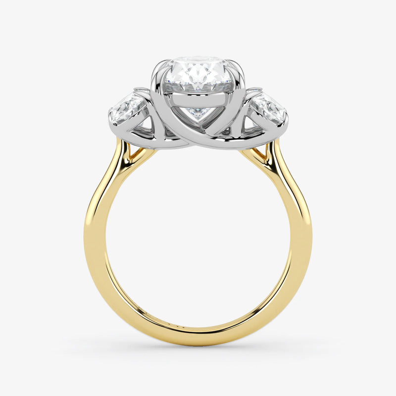 Gold and silver ring with a diamond on a white background