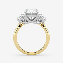 Two-tone gold ring with a diamond on a white background