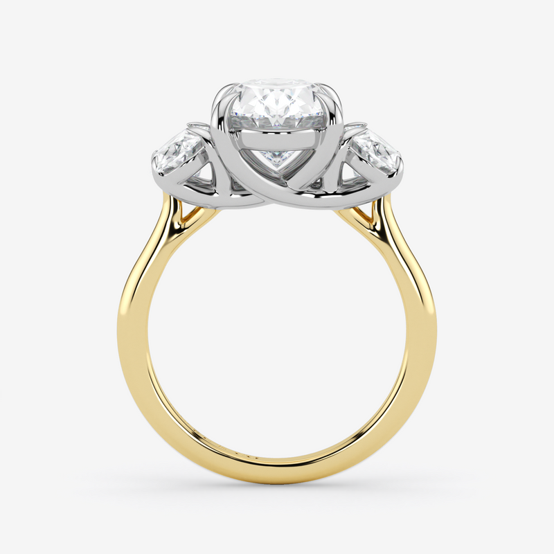 Two-tone gold ring with a diamond on a white background