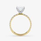 Two-tone diamond ring with a heart-shaped center stone on a white background