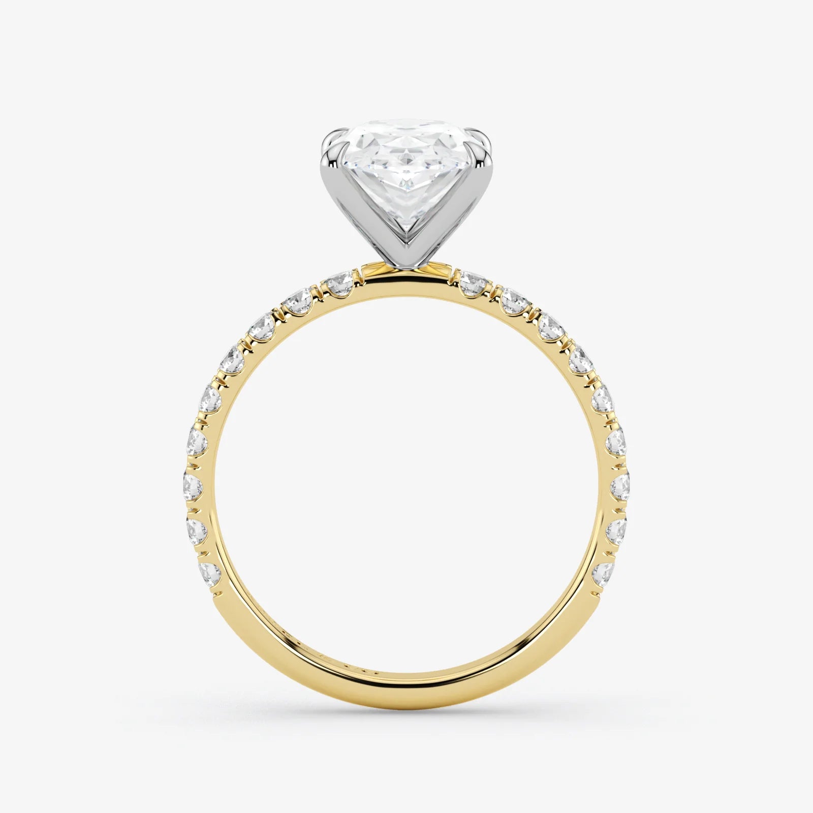 Two-tone diamond ring with a heart-shaped center stone on a white background