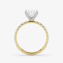 Two-tone diamond ring with a heart-shaped center stone on a white background
