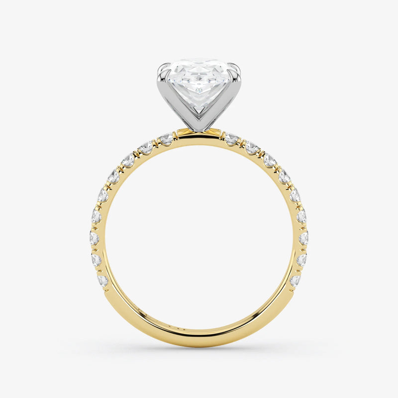 Two-tone diamond ring with a heart-shaped center stone on a white background