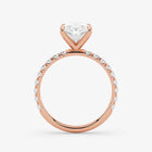 Rose gold ring with a diamond on a white background