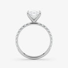 Diamond ring with a heart-shaped center stone on a white background
