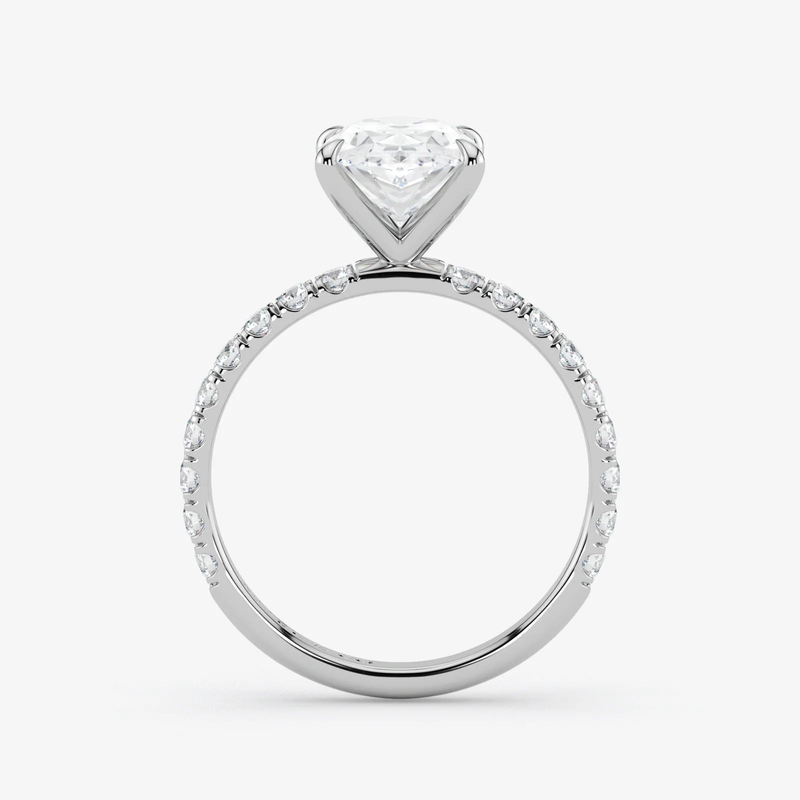Diamond ring with a heart-shaped center stone on a white background
