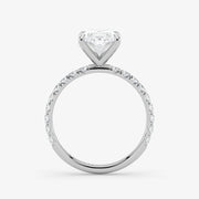 Diamond ring with a heart-shaped center stone on a white background
